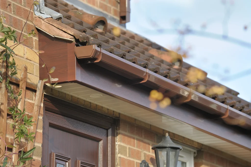 Brown Wood Effect Soffit, Fascia and Gutter installation in Dronfield